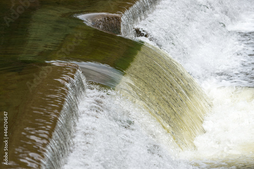 river weir with flowing water - backgrounds 
