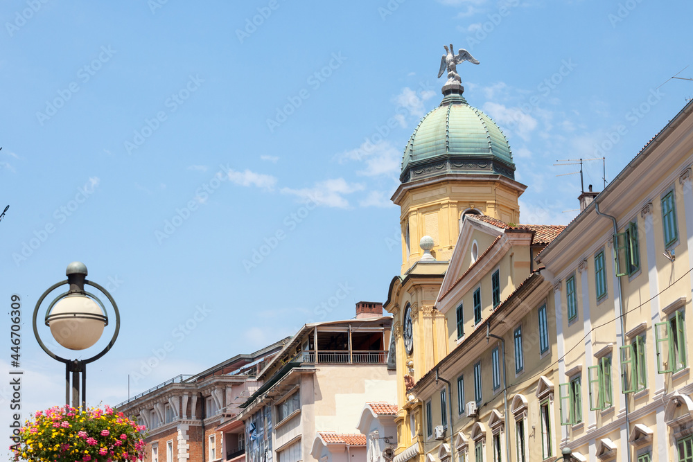 Facades of the Korzo street in Rijeka, croatia, with the city tower, or gradski toranj, a baroque clocktower from the 19th century, and a major landmark of Rijeka and Istria. ..