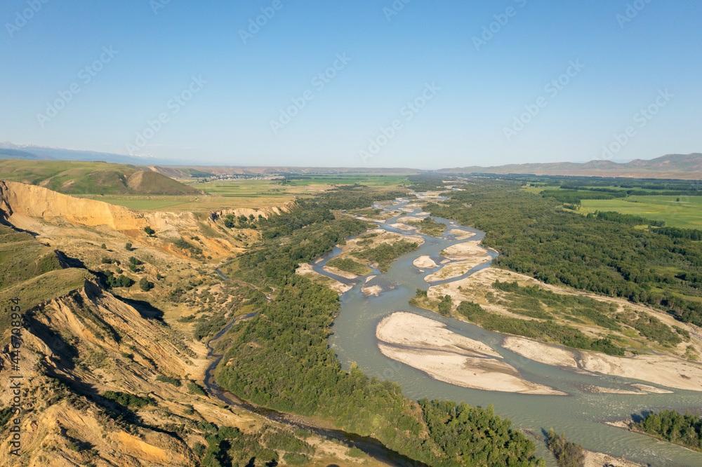 Grassland and river in a sunny day. Grassland and river in a sunny day.