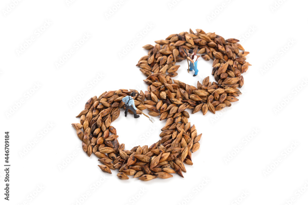 Miniature workers put barley tea as number 8 on white background Miniature workers put barley tea as number 8 on white background