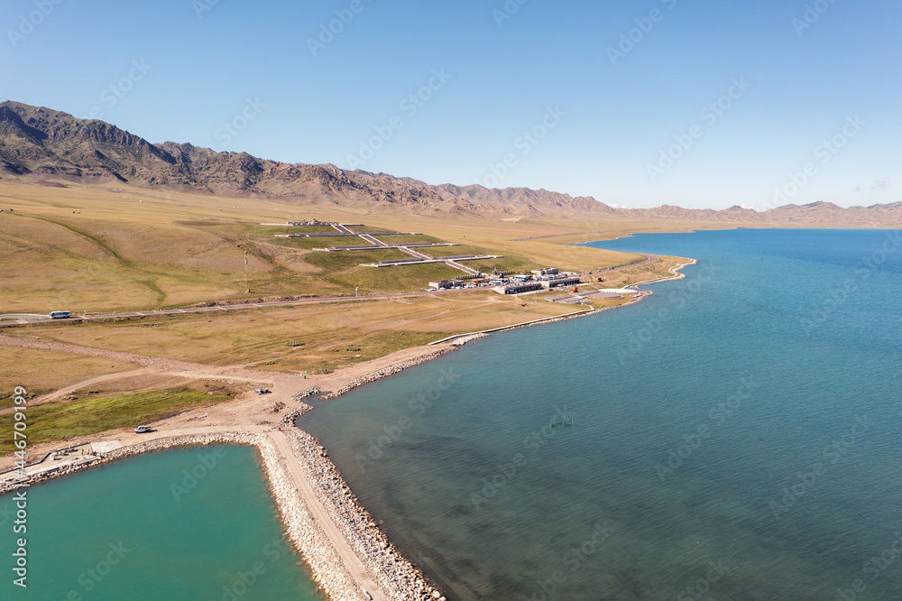 Lake and grassland with a sunny day. Shot in Sayram Lake in Xinjiang, China. Lake and grassland with a sunny day. Shot in Sayram Lake in Xinjiang, China.