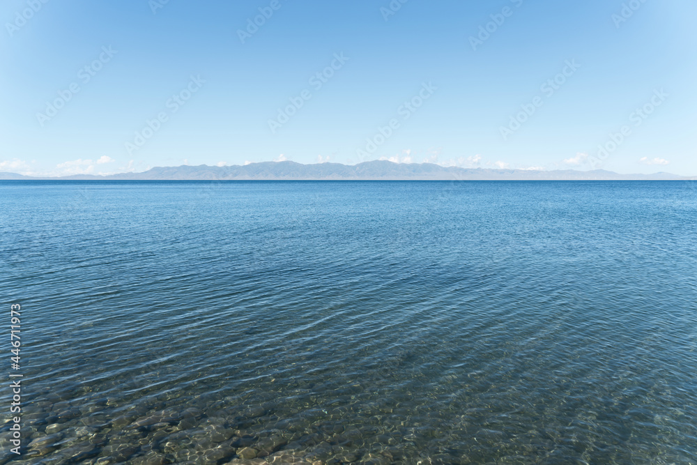 Calm surface of the lake with a sunny day. Shot in Sayram Lake in Xinjiang, China.
