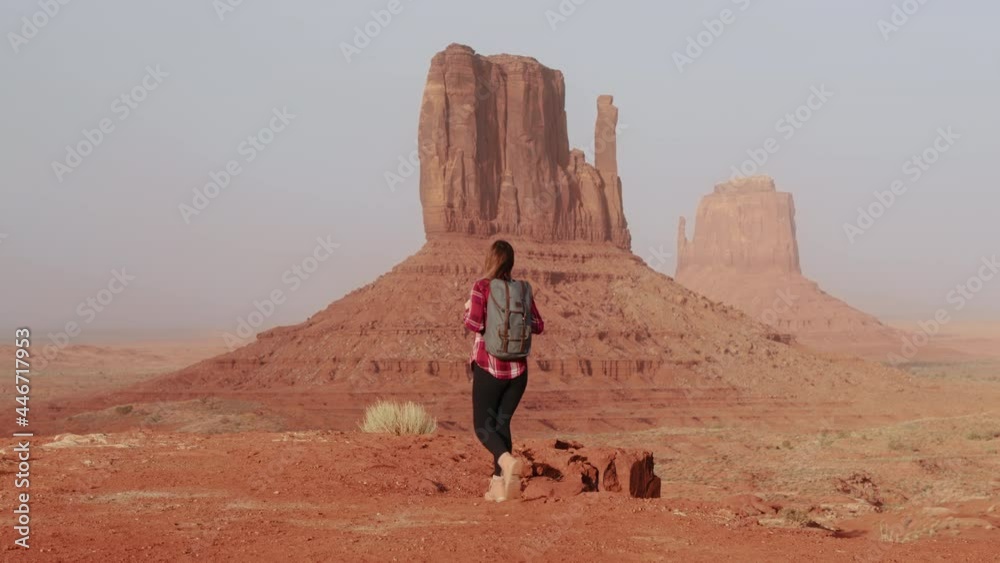 Cinematic female traveler walking in scenic red desert park landscape view 4K Cinematic female traveler walking in scenic red desert park landscape view 4K