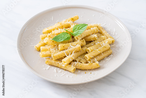 pesto rigatoni pasta with parmesan cheese