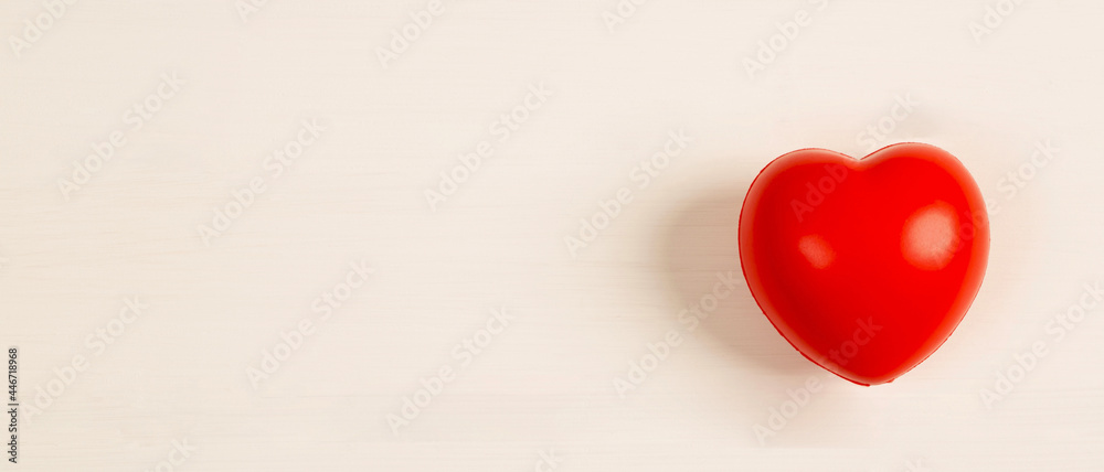 headphones and red hearts on white wooden background .health care and self-treatment from heart disease headphones and red hearts on white wooden background .health care and self-treatment from heart disease