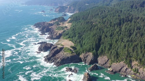 The cold Pacific Ocean washes against the scenic yet rugged coastline of southern Oregon. This beautiful region of the Pacific Northwest is accessible via highway 101.