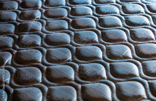 Motif répétitif dans le tissus sur un matelas vue de proche avec lumière venant de l'arrière plan photo