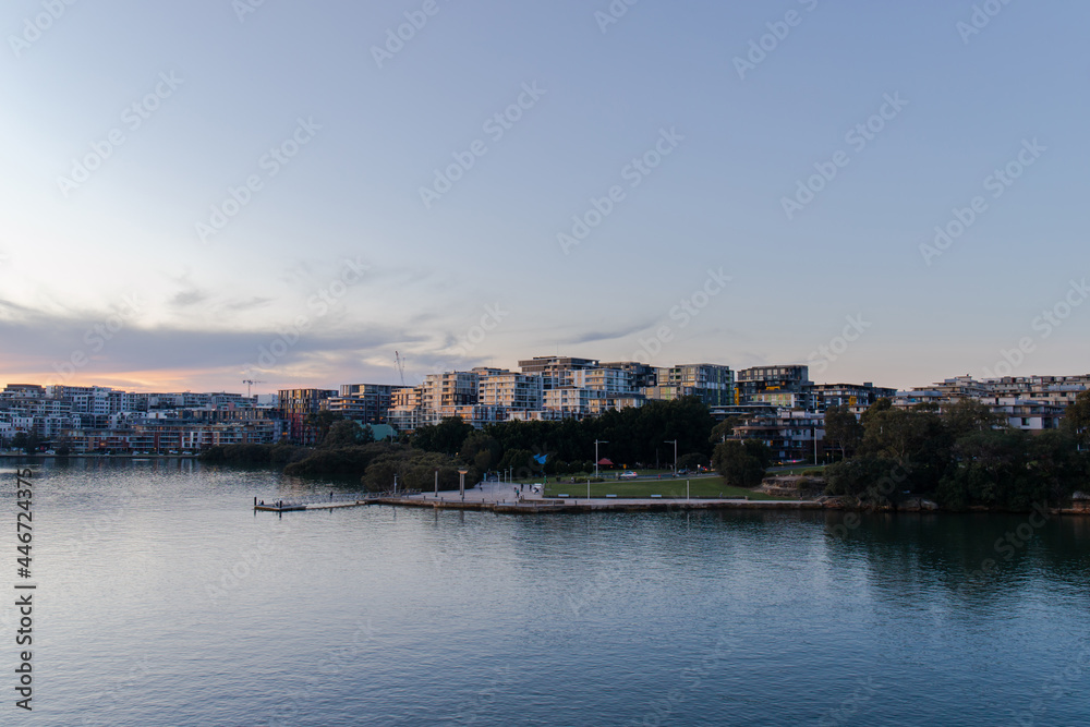 Sunset view of Meadowbank and Ryde from Parramatta River waterfront.