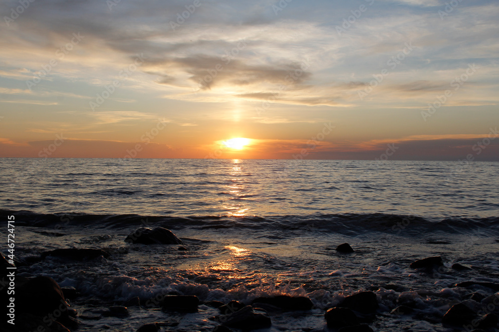 Sunset on the Sea of Azov. Beautiful landscape with an evening sunset sky over a calm sea Sunset on the Sea of Azov. Beautiful landscape with an evening sunset sky over a calm sea