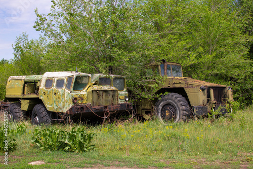 Old Soviet military equipment in the forest. Heavy military equipment abandoned in the forest.