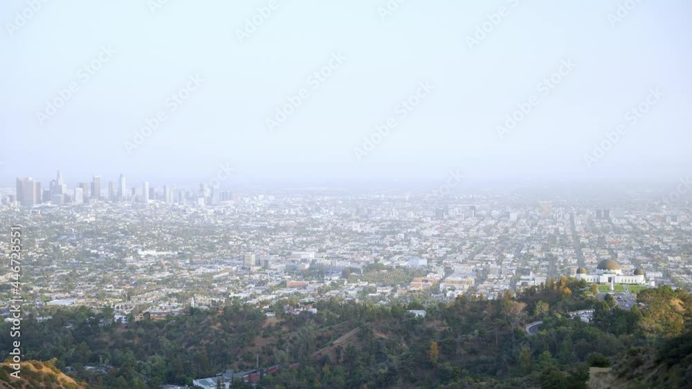 Panoramic view of Los Angeles downtown and the Griffith Observatory from the mountains Panoramic view of Los Angeles downtown and the Griffith Observatory from the mountains