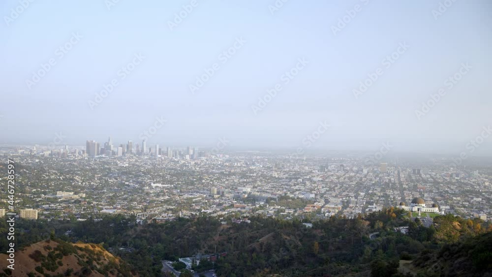 Griffith Observatory and Los Angeles cityscape view from far away Griffith Observatory and Los Angeles cityscape view from far away
