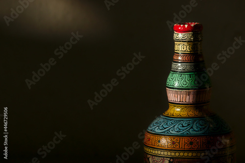 Close-up of a bottle painted in the traditional Patachitra style of Odisha, India