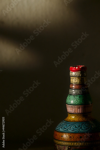 Close-up of a bottle painted in the traditional Patachitra style of Odisha, India