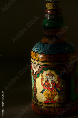 Close-up of a bottle painted in the traditional Patachitra style of Odisha, India