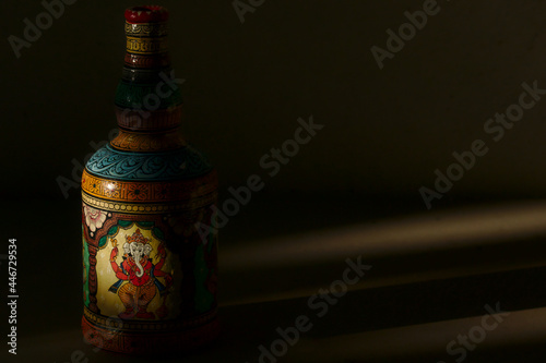 Close-up of a bottle painted in the traditional Patachitra style of Odisha, India