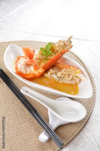 poached big fresh tiger prawn seafood with chinese herb and wine sauce in white background asian halal menu