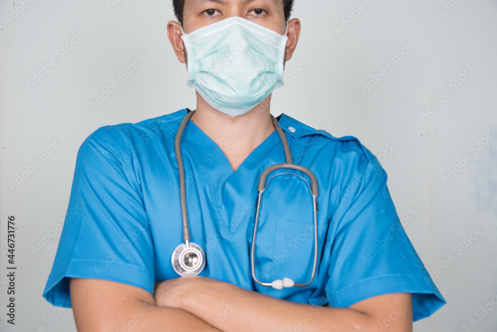 Medical Doctor/Nures in uniform ware protection equipment from pathogen. Medical staff in isolated background in hospital. Medical Doctor/Nures in uniform ware protection equipment from pathogen. Medical staff in isolated background in hospital.