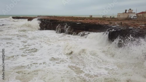 Waves crashing on the Rocks. Pure power, exhibition of nature forces. Pure energy. Ocean power against earth. This is how Erosion occurs. Waves crashing on the Rocks.