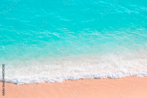 Wave, sand and turquoise sea from above. Aerial view of the beach.