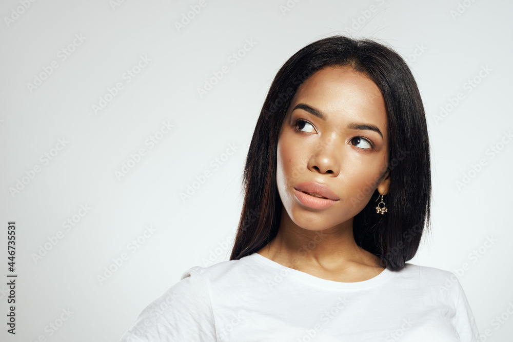 woman with long black hair posing white t-shirt cosmetics studio woman with long black hair posing white t-shirt cosmetics studio
