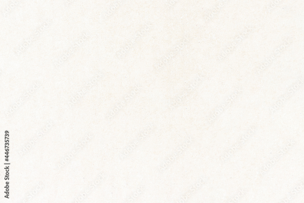 Fototapeta premium Light uniform texture of a smooth sheet of paper. The surface of the cardboard with small inclusions.