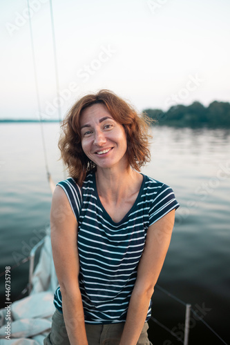 Portrait of a smiling woman on a yacht