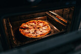 Cooking homemade pizza in the oven.