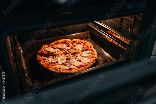 Cooking homemade pizza in the oven.