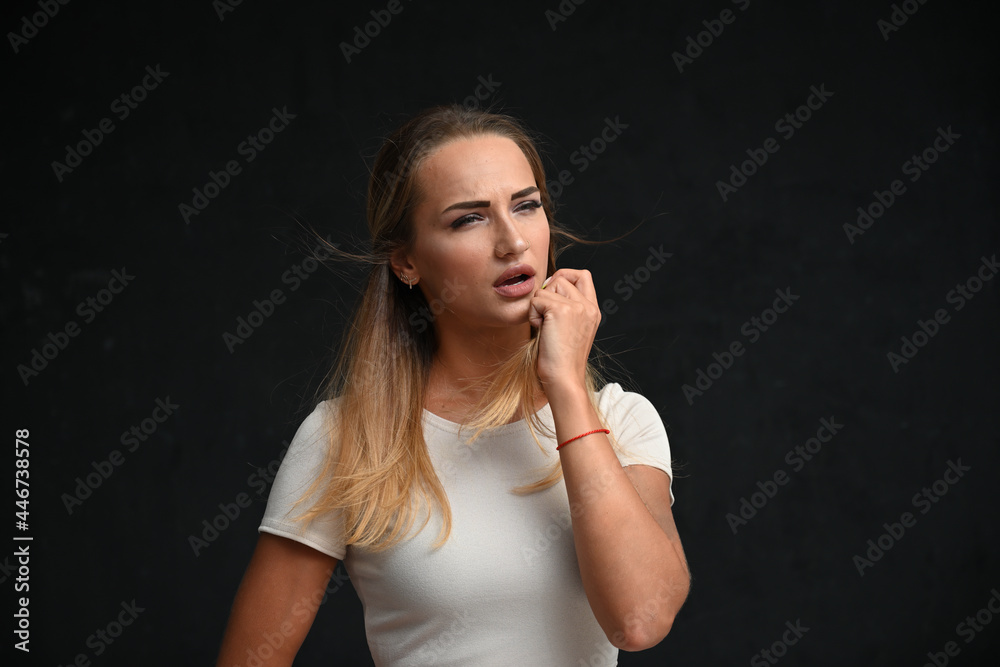 Portrait of beauty caucasian woman looking to the side, showing emotions on black background Portrait of beauty caucasian woman looking to the side, showing emotions on black background