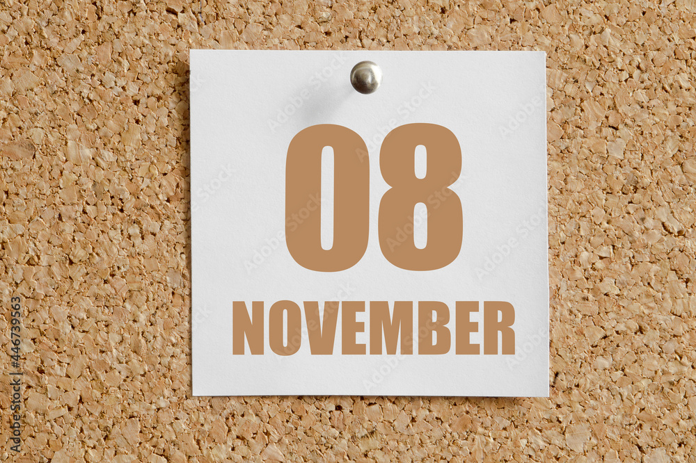 november 08. 08th day of the month, calendar date.White calendar sheet attached to brown cork board.Autumn month, day of the year concept november 08. 08th day of the month, calendar date.White calendar sheet attached to brown cork board.Autumn month, day of the year concept