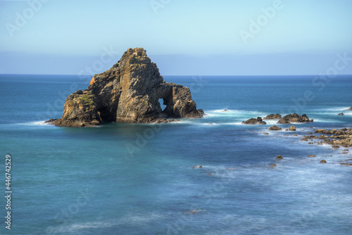 Marine rocky cliff with two arches