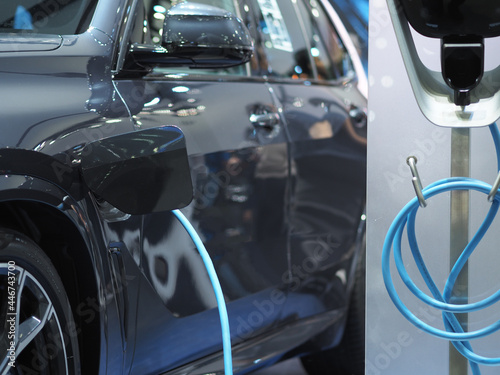 Electric charging vehicle socket plug in recharge battery at car blue color clean energy power for future concept