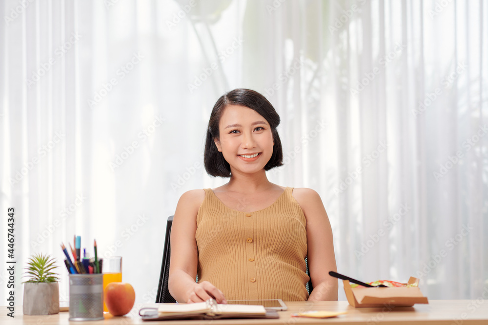 pregnant asian woman working from home in modern white office pregnant asian woman working from home in modern white office