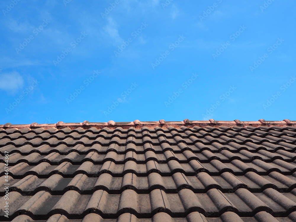 Black roof with blue sky background,Midday and blue sky with roof