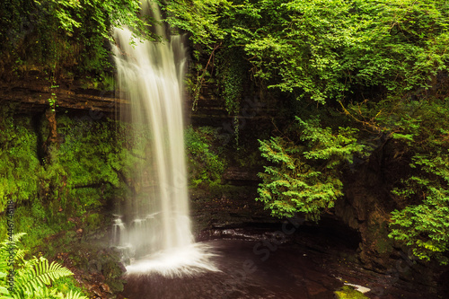 Beautiful water fall in a forest © mark_gusev