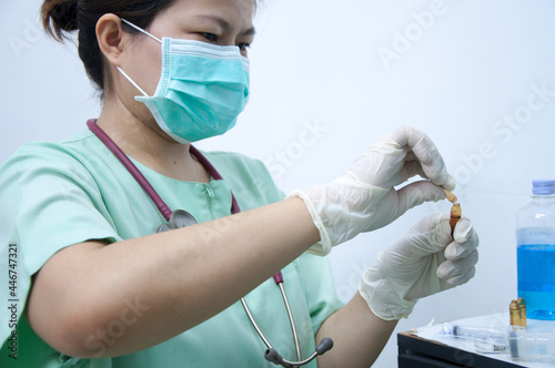 Nurse filling the medical syringe. Medical doctor provide medicine injection for treatment.