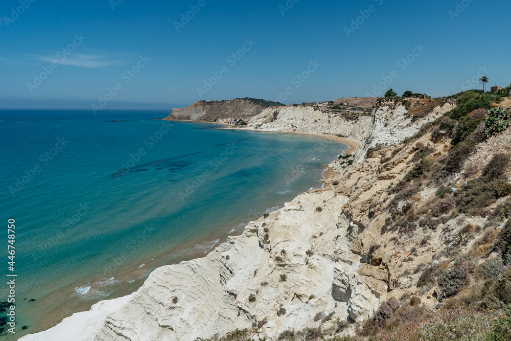 Scala dei Turchi,Sicily,Italy.Aerial view of white rocky cliffs,turquoise clear water.Sicilian seaside tourism,popular tourist attraction.Limestone rock formation on coast.Travel holiday scenery. Scala dei Turchi,Sicily,Italy.Aerial view of white rocky cliffs,turquoise clear water.Sicilian seaside tourism,popular tourist attraction.Limestone rock formation on coast.Travel holiday scenery.