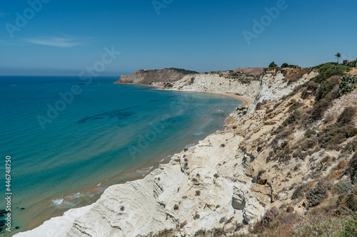 Scala dei Turchi,Sicily,Italy.Aerial view of white rocky cliffs,turquoise clear water.Sicilian seaside tourism,popular tourist attraction.Limestone rock formation on coast.Travel holiday scenery.