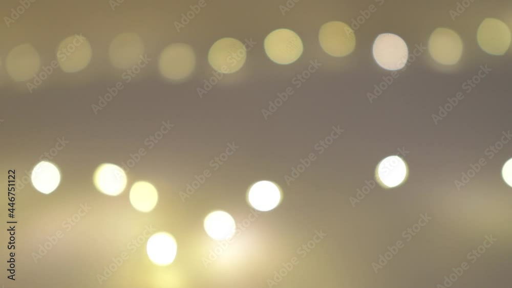 blurred lights of the garland, the background of the bulbs is out of focus blurred lights of the garland, the background of the bulbs is out of focus