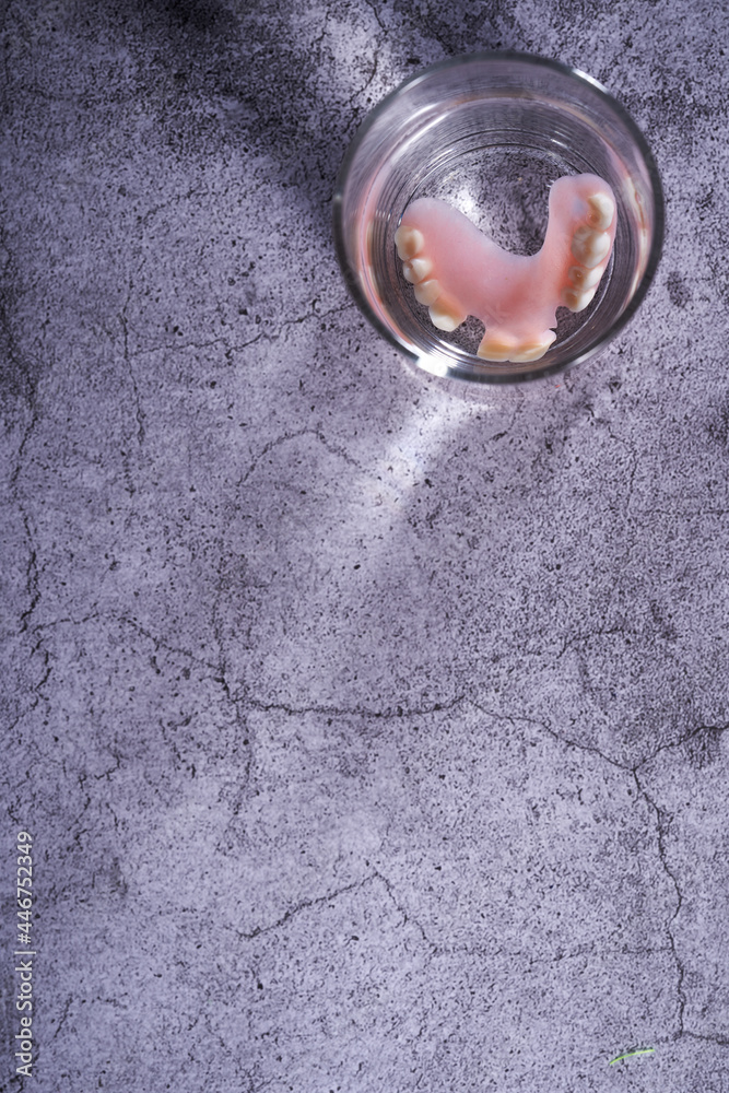 top view of denture in a drinking glass top view of denture in a drinking glass