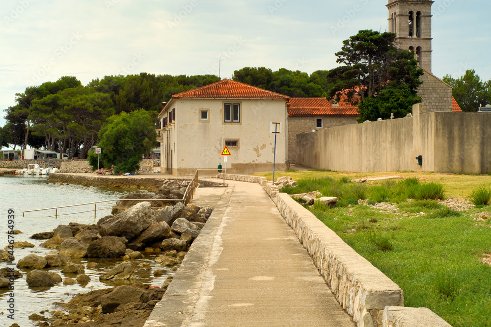 Old town of Osor and beautiful Adriatic sea coast on a cloudy day on Croatia islands Cres and Losinj