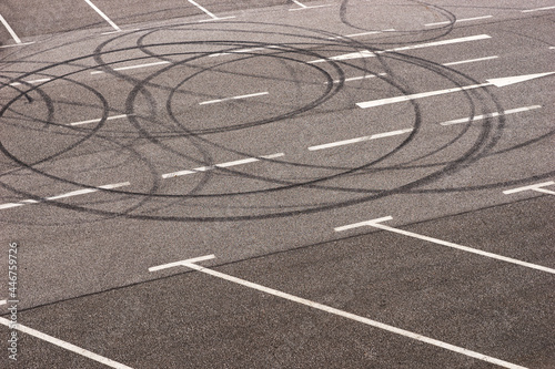 Burned tire marks in the parking lot. Donut tire tracks