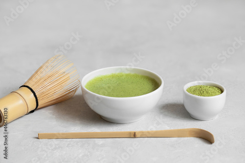 Matcha green tea. Set for a Japanese tea ceremony on a gray concrete background. Copy space