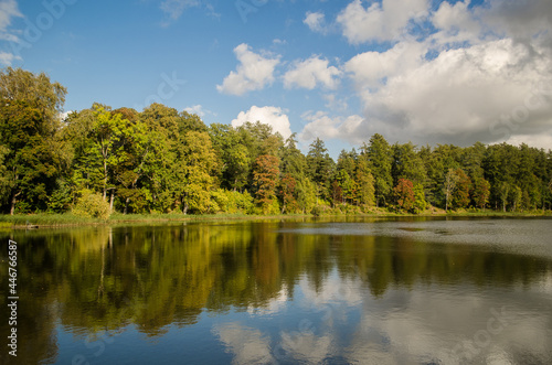 Kazdanga village mill lake in sunny autumn day, Latvia.