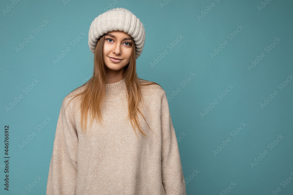 Beautiful positive happy young dark blonde woman isolated over colourful background wall wearing casual stylish clothes feeling sincere emotions looking at camera Beautiful positive happy young dark blonde woman isolated over colourful background wall wearing casual stylish clothes feeling sincere emotions looking at camera