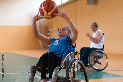 a young woman playing wheelchair basketball in a professional team. Gender equality, the concept of sports with disabilities. 