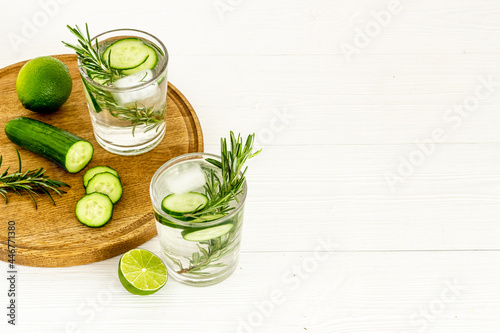 Lemonade with cucumber lime and herbs in glasses