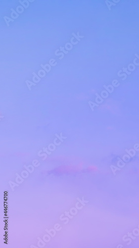 Vertical shot of smooth gradient pastel purple blue sky background with little cloud