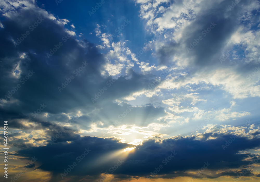 blue sky with clouds, bright light from heaven, the rays of the sun